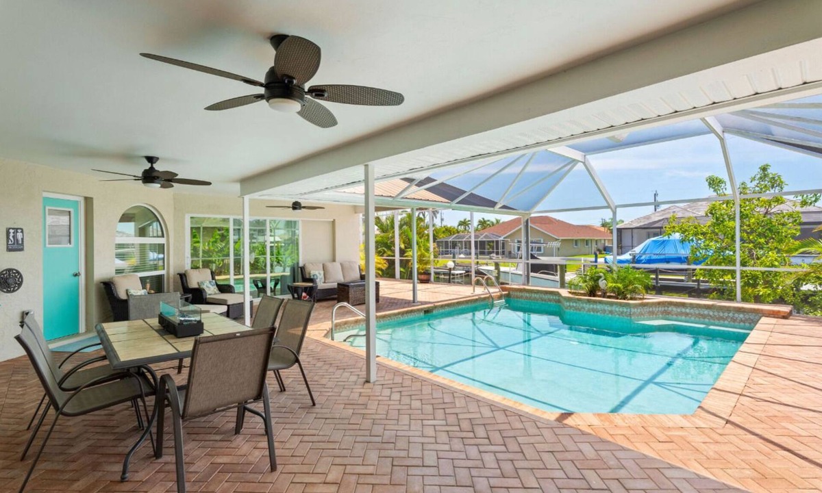 Pelican House | 25 Min to Fort Myers Beach, Canal front, large heated pool: Dive into Relaxation