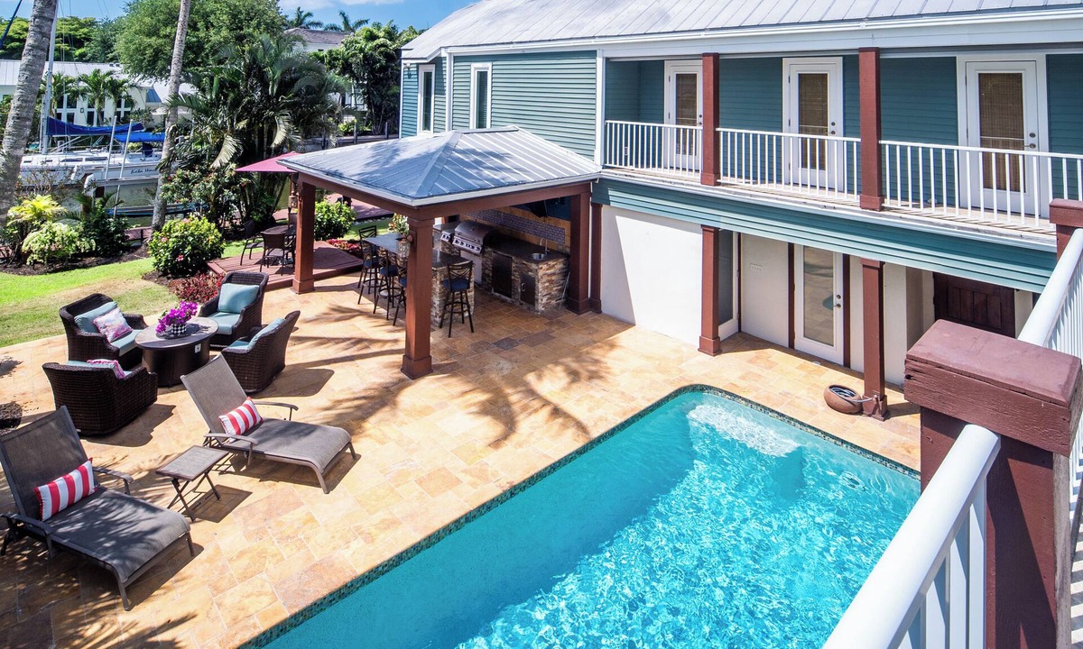 Old Naples House | 3-Blocks to Beach, Steps from 3rd Street Dinning, Waterfront Pool Home on Canal