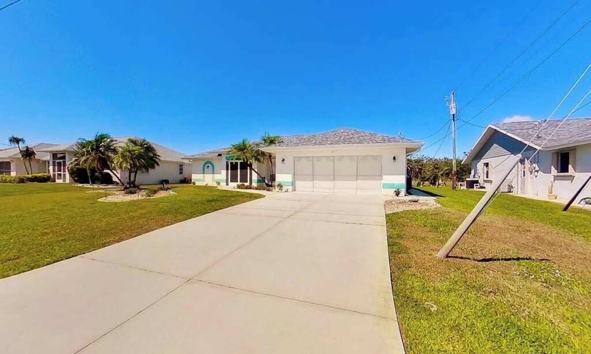 Pebble Beach House | Bohemian canal-front retreat with pool, beach gear, adult bikes, & AC - dogs ok