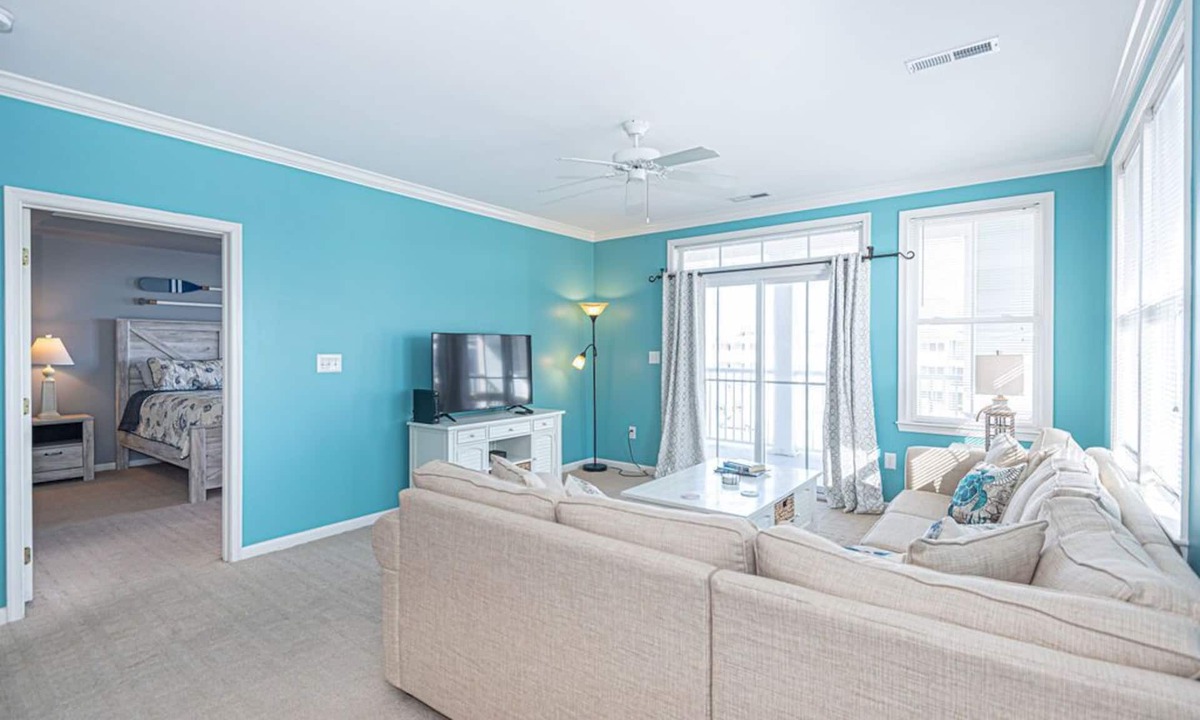 Sunset Island Condo | Bright, modern 3-bedroom luxury condo in gated community, free WiFi, private bayside beaches, an indoor and outdoor pool, and more located midtown and a couple blocks to the ocean!