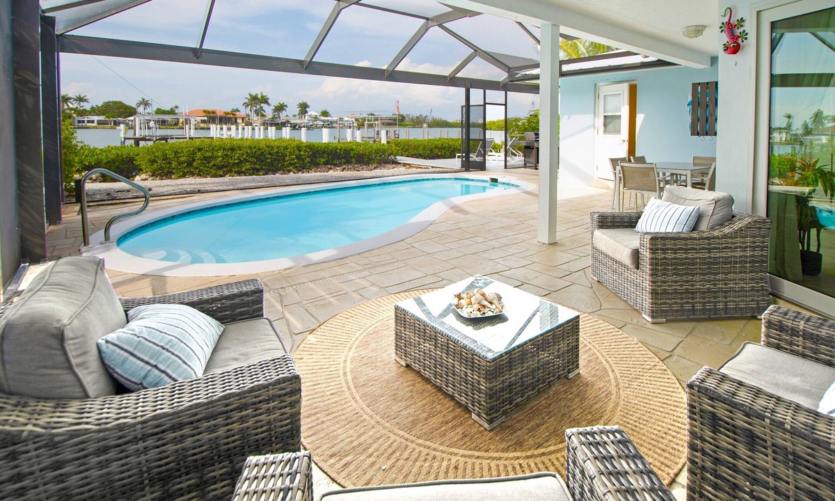 Isles of Capri House | CAPRI PARADISE! Beautiful waterfront home. Solar heated pool, 130ft dock.