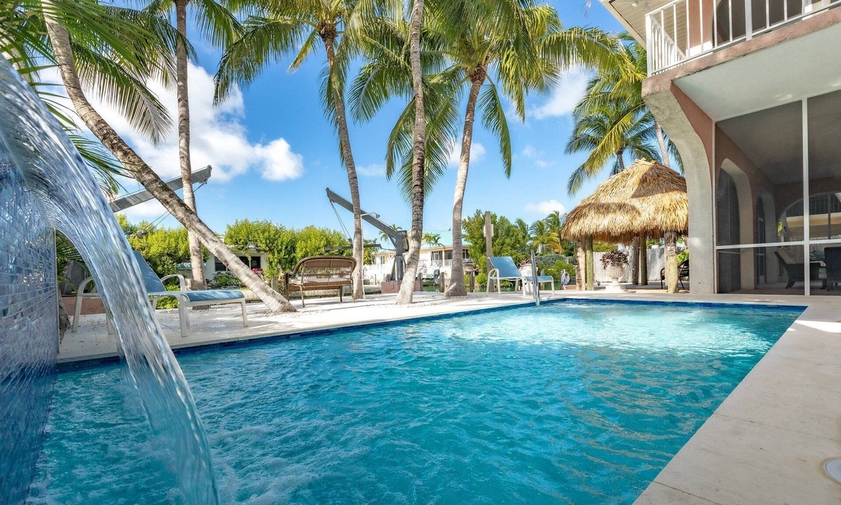 Cudjoe Key House | Casa Rosada: Cudjoe Gardens Canal Front Retreat, Pool, Tiki, Deep Dockage & Rapid Open Water Access!