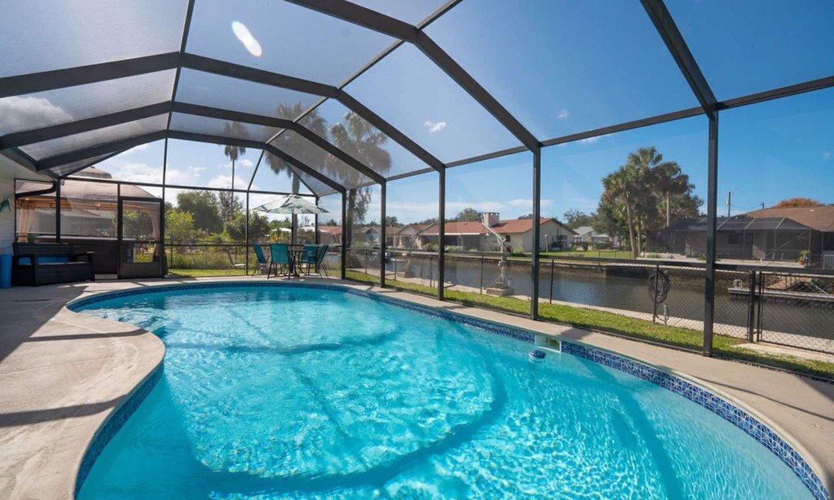 Indian Waters House | Crystal River Pool Home ~ Waterfront w/Boat Dock, Hot Tub & fenced backyard.