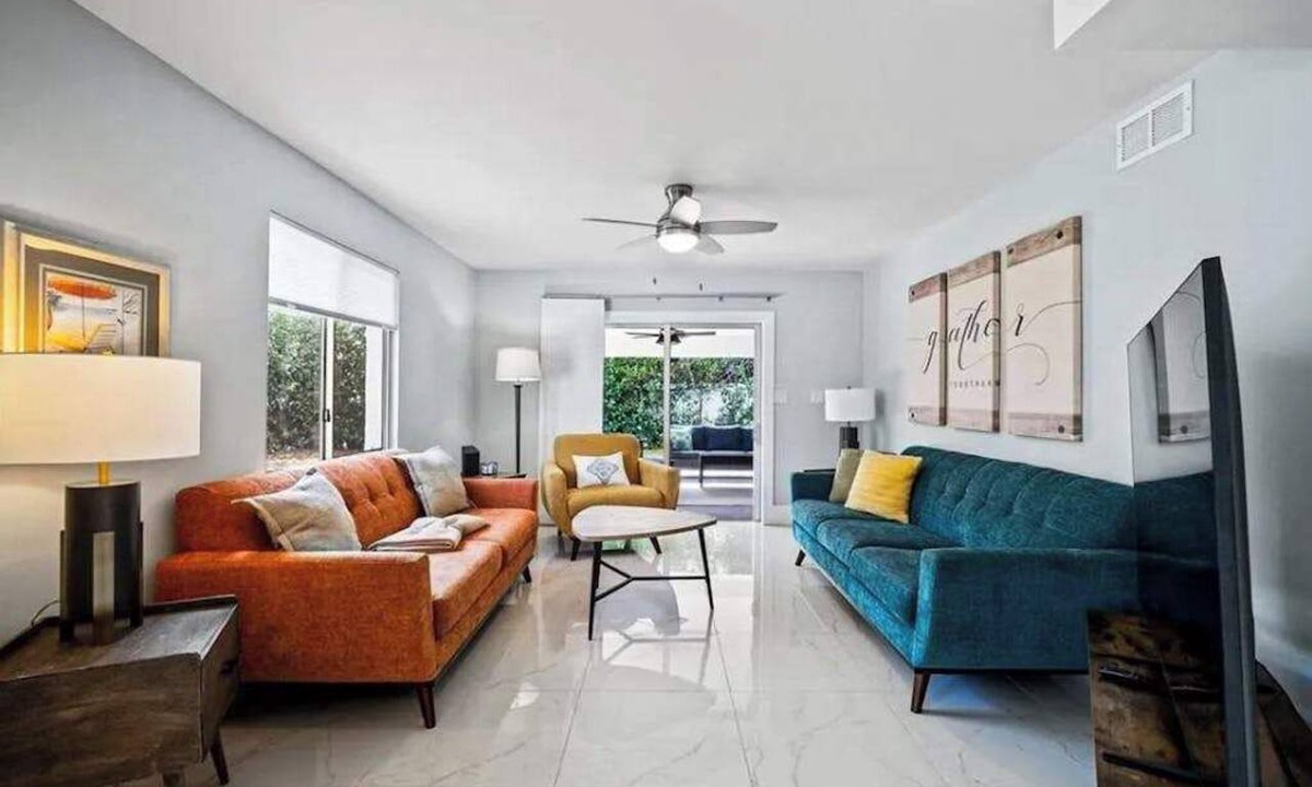 Isles of Capri Condo | Dog-friendly colorful condo with shaded patio, washer/dryer, & central AC