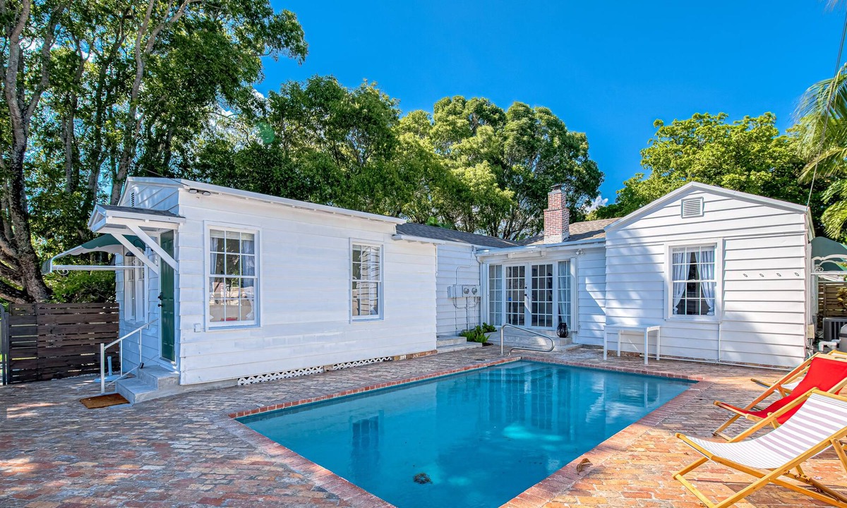 Poiciana Park II House | Dog-friendly home with pool, enclosed yard, patio, central AC & washer/dryer