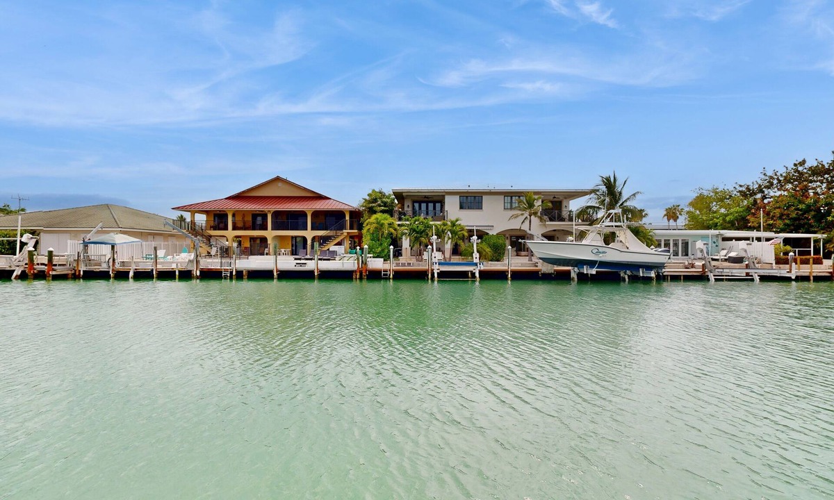 Key Colony Beach House | Dog-friendly waterfront home with dock, pool, gas grill, & beach access