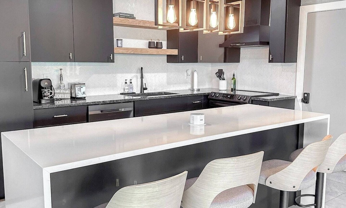 Yacht Club House | Experience modern waterfront living in Cape Coral’s Yacht Club district. Walk to the beach for stunning sunsets, plug in with on-site EV charging, and keep your boat moored at our private backyard dock. Direct gulf access with no bridges!