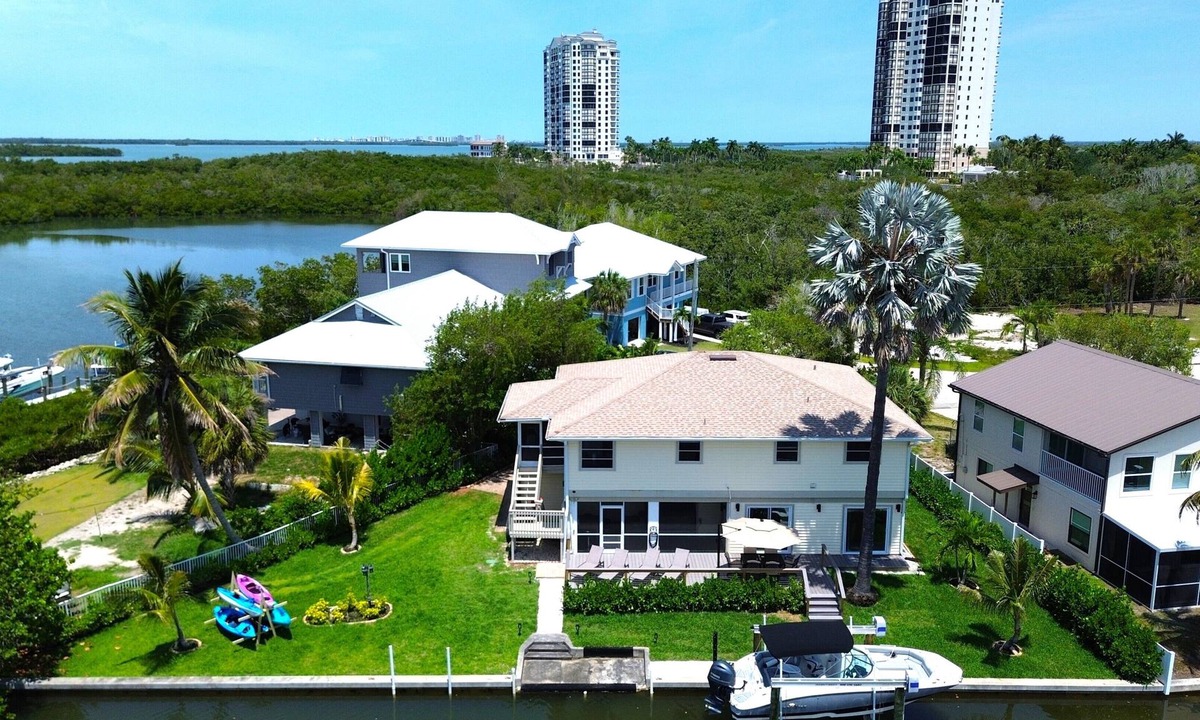 Estero Bay Shores House | Gulf Access Canal 3 BR Home: Bring your Boat, Kayaks, Game Room, Gym, Hot Tub