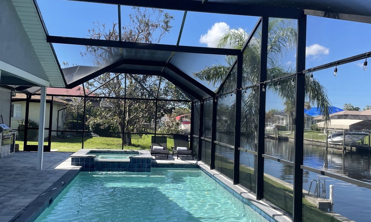 Caloosahatchee House | Gulf access pet friendly waterfront oasis with NEW heated salt water pool & spa