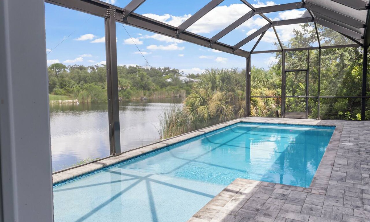 South Gulf Cove House | Luxury Relaxing Waterfront House - Heated Pool - 4BD - Family and Pets Friendly