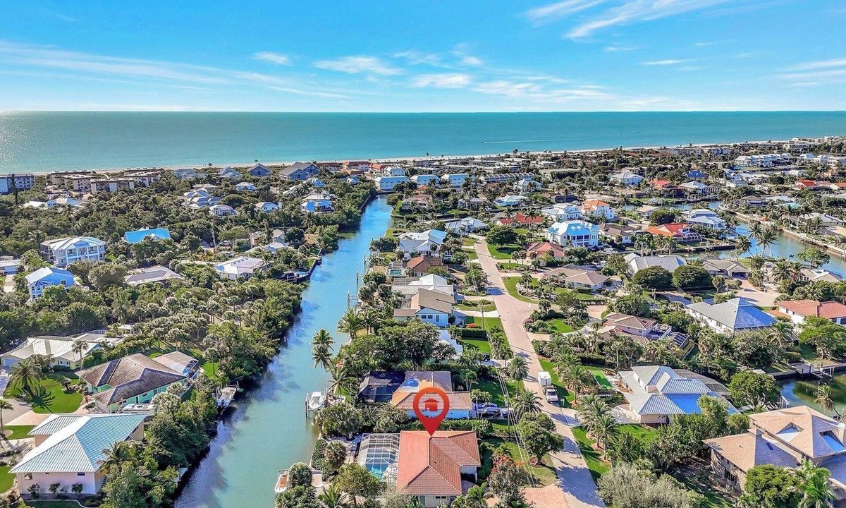 Shell Harbor House | Manatee Cove - Gorgeous Canal Front Home with Heated Pool and Deeded Beach Access!