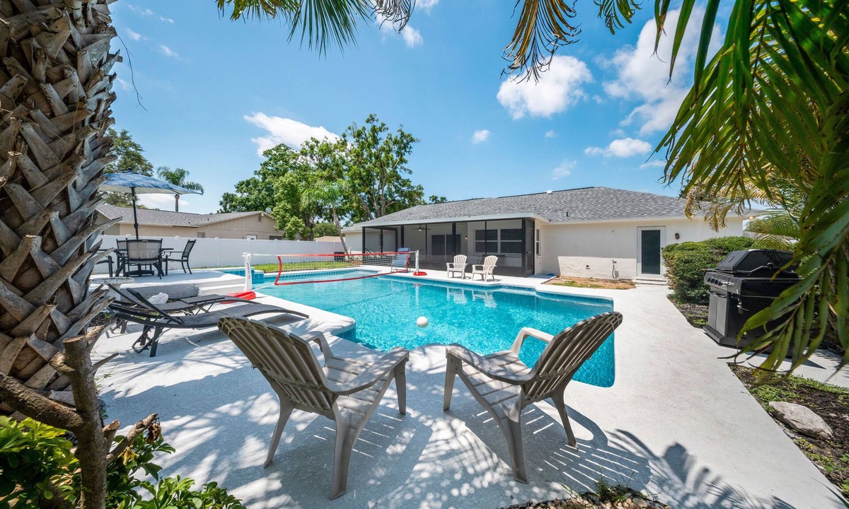 Lake Magdalene House | Resort Pool + Arcade Room: Hammock + Grill