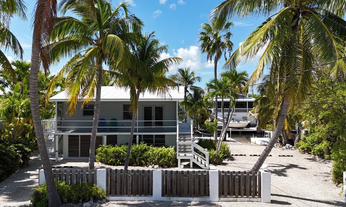 Breezeswept Beach Estates House | Tropical Charm ~ Lower Keys Waterfront Gem with Dock & 9,000' Lot