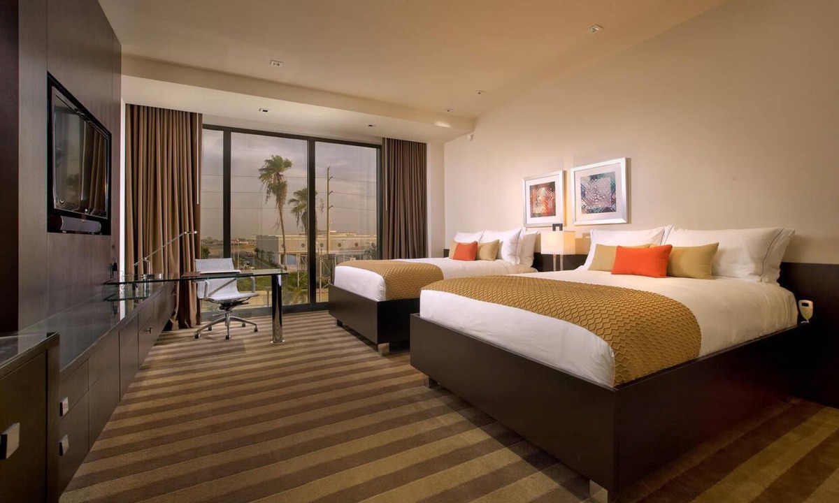 Seybold Hotel | Two Convenient Rooms with Large Glass Window and Outdoor Pool