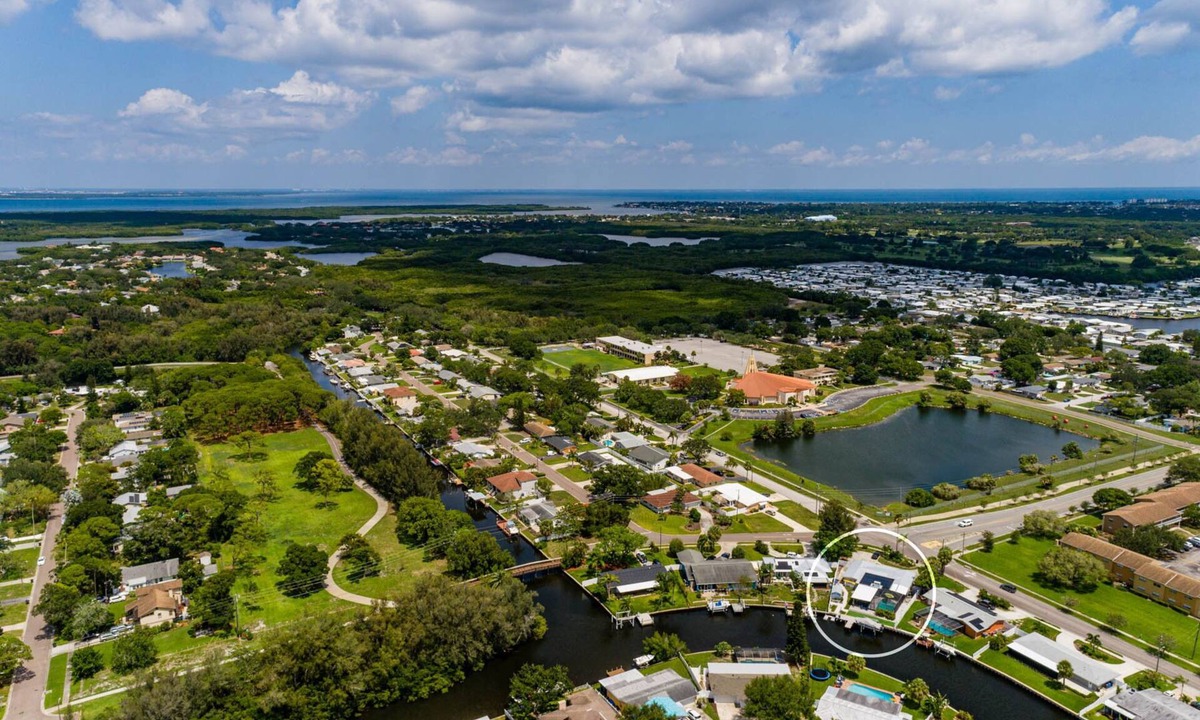 Riviera Bay House | Waterfront Canal Retreat Pool, Dock, 10 Min to DTSP Sleeps 8