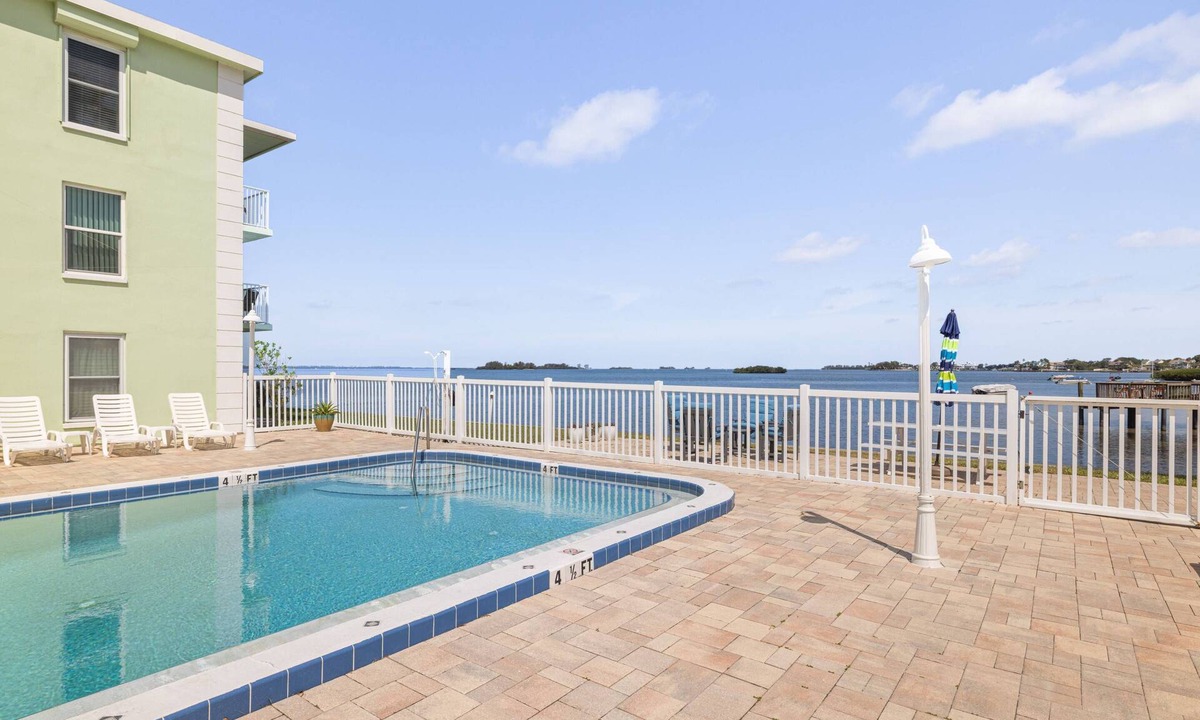 Dunedin Condo | Waterfront Escape! Heated Pool, BBQ, Clubhouse & Pier – Dolphins & Sunsets from Your Private Porch!