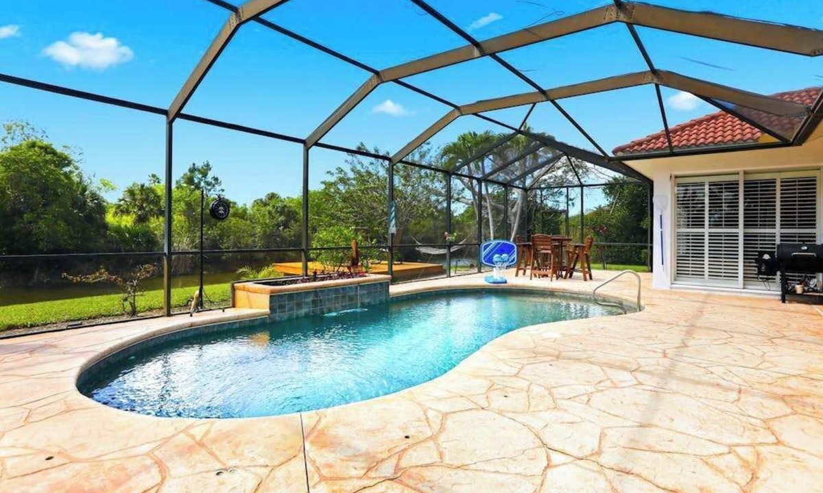 Bell Villa House | Waterfront home with private heated pool, dock, firepit, grill, bikes, fireplace