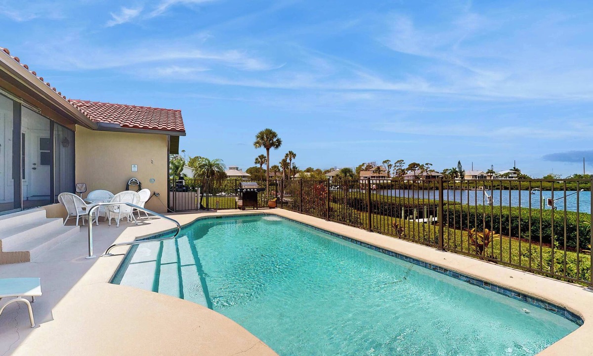 Bay Harbor Estates House | Waterfront pool home, family friendly, close to beaches with AC, WD and WIFI