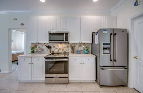 Biggar House | 16684 Wellington Pet Friendly Pool Home by Beach