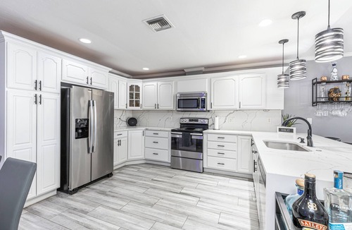 Naples Park House | 2 Pool homes located right next door to each other 7 total bedroom 4 total baths