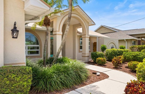 Pelican House | 25 Min to Fort Myers Beach, Canal front, large heated pool: Dive into Relaxation