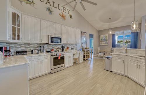 Caloosahatchee House | 2790 Sq Ft, Open Concept, One Story Gulf Access Home with Private Dock and 20,000 lb Boat Lift, 4 complimentary watercraft, Fenced Yard, Heated Pool, Children's and Adult Bikes, Fishing and Beach Gear, Family Ready and Dog Friendly!