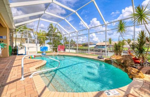 Caloosahatchee House | 2790 Sq Ft, Open Concept, One Story Gulf Access Home with Private Dock and 20,000 lb Boat Lift, 4 complimentary watercraft, Fenced Yard, Heated Pool, Children's and Adult Bikes, Fishing and Beach Gear, Family Ready and Dog Friendly!