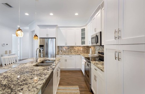 Naples Park House | 833 Naples Oasis: 4BR, Heated Pool, Steps to Beach!