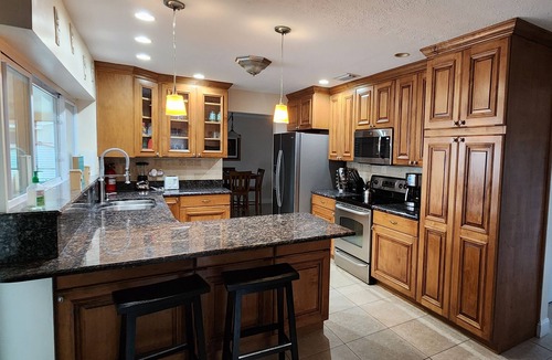 Apollo Beach House | Apollo Beach Waterfront 3BR — Private Dock, Heated Saltwater Pool & Kayaks