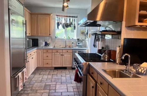 A-Zone House | Bayfront 6-bedroom home, sleeps 16 with AC, in-ground pool and spa. Dog friendly