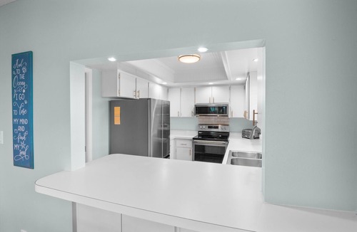 Holmes Beach Condo | Beachy Butterfly! Poolside Holmes Beach Stay!