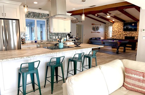 Caloosahatchee House | Beautiful Dog Friendly Home with Screened-in Heated Pool, Game Room/Bar