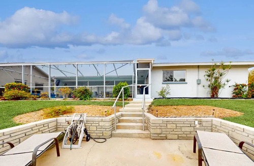 Lochmoor Waterway Estates House | Beautiful Waterfront Home with Heated Pool in Quiet Neighborhood