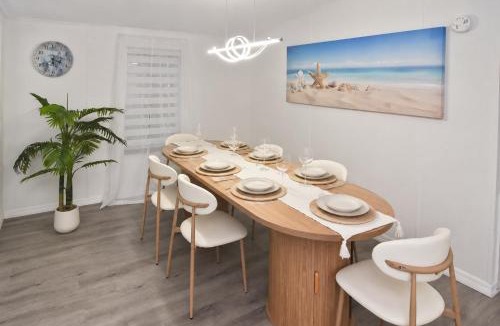 Iona House | Book A Paradise with Jacuzzi, BBQ & Paddleboards