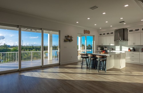 Marathon Villa | Brand New Single Family 5/5 -90ft dock, pool, paddle boards, bicycles plus more!