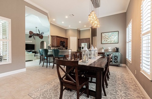 Central Naples House | Briarwood Upscale home with two primary suite-heated pool & spa- entertaining area w/TV