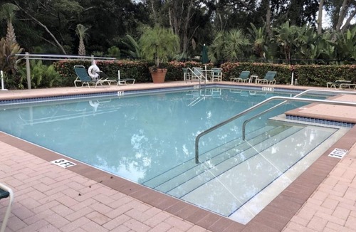 Bonita Bay Condo | Bright & beautiful with lake and golf course views!