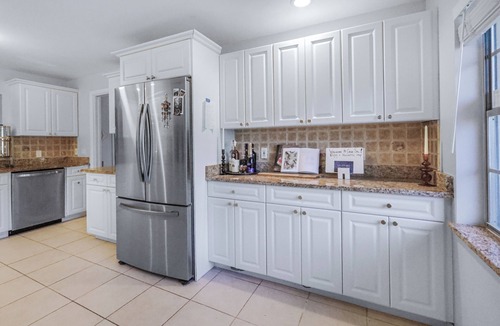 Fort Pierce House | Bright spacious beautifully designed pool home with fireplace fast wifi sleeps 8