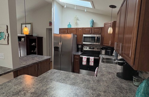 Fort Myers House | Cape Coral- 3 bedroom, 2 bath, beautiful yard with hottub & lanai; pets allowed.