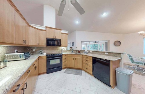 Englewood House | Charming beachside duplex steps to the Gulf with bikes and coastal views