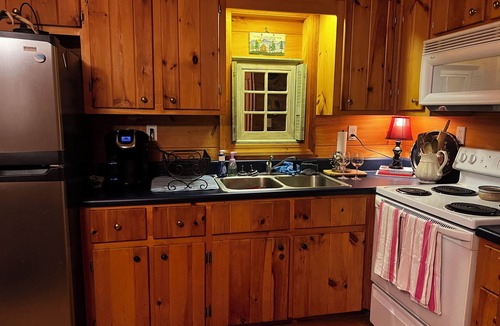 Green Mountain Cabin | Charming riverfront 2-bedroom cabin with hot tub, WiFi, AC in Green Mountain NC
