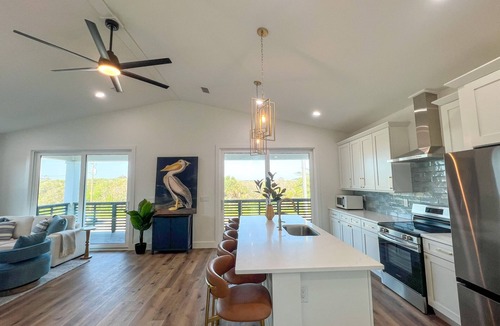 Butler Beach House | Coastal Luxe, Ultimate Fun Retreat, Walk to beach, Mins to Dwntwn, Pet friendly