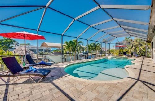 Yacht Club Villa | CoralVilla Felicity - pool, spa, river access, Tiki Hut