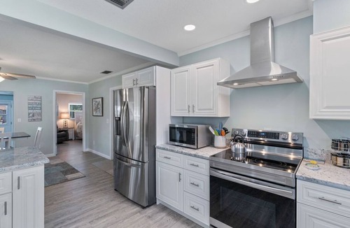 Indian Waters House | Crystal River Pool Home ~ Waterfront w/Boat Dock, Hot Tub & fenced backyard.