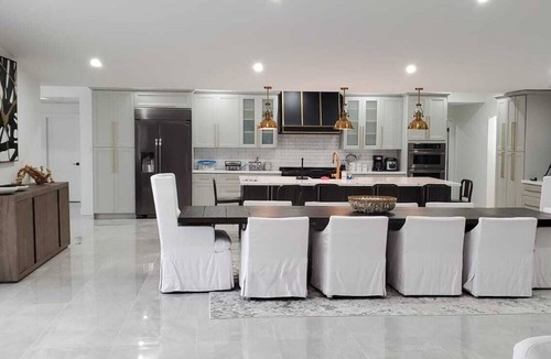 Caloosahatchee House | Custom Home with tile pool, boating dock and every comfort