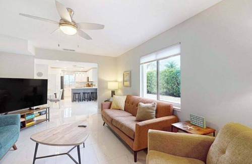 Isles of Capri Condo | Dog-friendly colorful condo with shaded patio, washer/dryer, & central AC