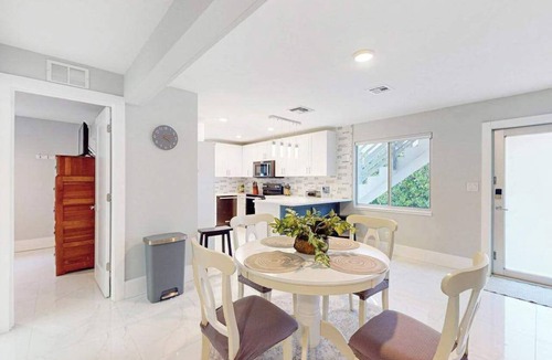 Isles of Capri Condo | Dog-friendly colorful condo with shaded patio, washer/dryer, & central AC