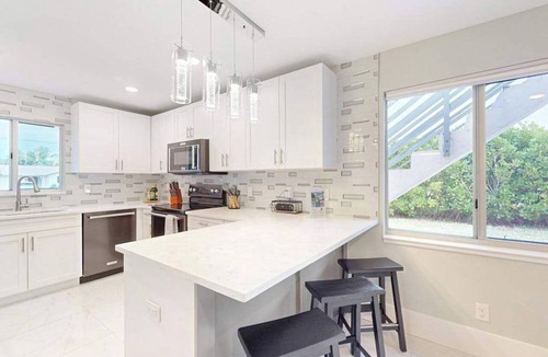 Isles of Capri Condo | Dog-friendly duplex with a patio, deck, washers, dryers, & central AC