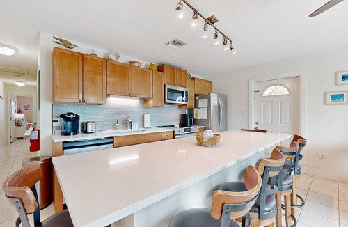 Key Colony Beach House | Dog-friendly waterfront home with dock, pool, gas grill, & beach access