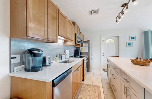Key Colony Beach House | Dog-friendly waterfront home with dock, pool, gas grill, & beach access